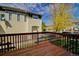 A view from the back deck features a shared yard and additional residences at 13033 Grant E Cir # B, Thornton, CO 80241