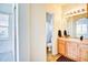 Well-lit bathroom featuring a spacious sink, a shower, and a toilet at 13033 Grant E Cir # B, Thornton, CO 80241