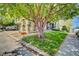 Attractive home exterior with a mature tree, green lawn, and a welcoming entrance at 13033 Grant E Cir # B, Thornton, CO 80241