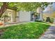 Two-story home with a well-manicured lawn and tasteful stone accents on the front porch columns at 13033 Grant E Cir # B, Thornton, CO 80241