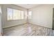 Clean, empty living room showcasing neutral walls, durable floors, and great natural light at 13033 Grant E Cir # B, Thornton, CO 80241