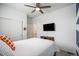 Serene bedroom featuring a full-size bed and built-in shelving at 24257 E 41St Ave, Aurora, CO 80019