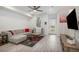Bright living room with modern flooring, a cozy gray couch, and plenty of natural light at 24257 E 41St Ave, Aurora, CO 80019