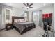 Comfortable primary bedroom with a large bed, ample natural light, and a ceiling fan at 24257 E 41St Ave, Aurora, CO 80019