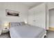 Cozy bedroom featuring a comfortable bed, minimalist decor, and a closet at 2900 N Downing St # 311, Denver, CO 80205