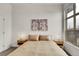 Bright bedroom showcasing neutral decor and a large window with a city view at 2900 N Downing St # 311, Denver, CO 80205