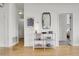 Hallway with console table featuring modern decor, mirror, and lighting at 2900 N Downing St # 311, Denver, CO 80205