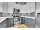 Well-equipped kitchen featuring stainless steel appliances, sleek countertops, and stylish backsplash at 2900 N Downing St # 311, Denver, CO 80205