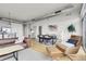 Spacious living room featuring modern decor, an open floor plan, and hardwood floors at 2900 N Downing St # 311, Denver, CO 80205