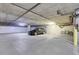 Spacious parking garage featuring ample space for a car and bicycle with a utilitarian design and concrete construction at 2900 N Downing St # 311, Denver, CO 80205