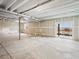 Unfinished basement with egress window and walkout entrance at 1947 S Coolidge Way, Aurora, CO 80018