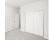 Bright bedroom featuring neutral carpet, and a closet, offering a comfortable and quiet space at 1947 S Coolidge Way, Aurora, CO 80018