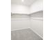 Spacious walk-in closet with ample shelving for organization and storage at 1947 S Coolidge Way, Aurora, CO 80018