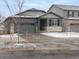 Charming single-Gathering home featuring stone accents, a gray two-car garage, and a beautifully landscaped yard in a suburban setting at 1947 S Coolidge Way, Aurora, CO 80018