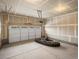 Spacious unfinished garage features a white door and provides ample space for parking and storage at 1947 S Coolidge Way, Aurora, CO 80018