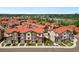 Aerial view showcasing a community near a lake at 2140 Santini Trl # F, Littleton, CO 80129