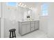 Dual sink bathroom featuring a wide vanity, open window, and neutral color palette at 2140 Santini Trl # F, Littleton, CO 80129