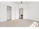 Bedroom featuring sliding closet door with closet rod with doorway visible in the background at 2140 Santini Trl # F, Littleton, CO 80129