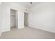 Spacious bedroom features neutral carpet, ceiling fan, and multiple entryways for flexible living at 2140 Santini Trl # F, Littleton, CO 80129