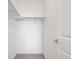 Simple walk-in closet with a minimalist design and open shelving for efficient storage solutions at 2140 Santini Trl # F, Littleton, CO 80129