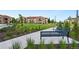 Community featuring a landscaped seating area near several condominium buildings at 2140 Santini Trl # F, Littleton, CO 80129