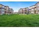A wide lawn area in the community offering residents a shared open space at 2140 Santini Trl # F, Littleton, CO 80129