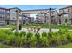 Inviting community space featuring a pergola-covered seating area surrounded by lush landscaping at 2140 Santini Trl # F, Littleton, CO 80129