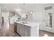 Lovely kitchen island featuring a stainless dishwasher and sink and a door that leads outside at 2140 Santini Trl # F, Littleton, CO 80129