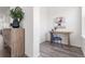 A simple office featuring a natural wood desk, art, decor and a wood floor at 2140 Santini Trl # F, Littleton, CO 80129