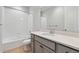 Clean bathroom featuring a shower-tub combination and vanity with light countertop at 1783 Morgan Dr, Erie, CO 80516
