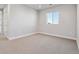 A neutral bedroom with a window, offering a calm and bright space at 1783 Morgan Dr, Erie, CO 80516