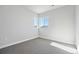 A bright bedroom with plush carpeting and a window with a view at 1783 Morgan Dr, Erie, CO 80516