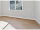 Minimalist bedroom with light hardwood flooring and ample natural light for a serene retreat at 1783 Morgan Dr, Erie, CO 80516