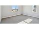 Well-lit bedroom features neutral carpet, ample natural light, and creates a comfortable and inviting atmosphere at 1783 Morgan Dr, Erie, CO 80516