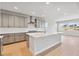 Stylish kitchen with stainless steel appliances, a spacious center island, and neutral color palette at 1783 Morgan Dr, Erie, CO 80516