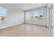Bright living room featuring large windows and light hardwood flooring, creating a welcoming and spacious ambiance at 1783 Morgan Dr, Erie, CO 80516