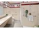 Bathroom featuring decorative tile, accessible hardware, and walk-in shower at 6008 S Van Gordon St, Littleton, CO 80127