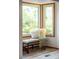 Close up of bay window with seat and decorative pillows, creating a cozy nook at 6008 S Van Gordon St, Littleton, CO 80127