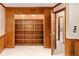 Bedroom with built-in wooden shelves, neutral carpet, and an open doorway at 6008 S Van Gordon St, Littleton, CO 80127