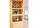 Kitchen featuring a wine rack built into the light wood cabinetry at 6008 S Van Gordon St, Littleton, CO 80127