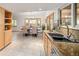 Bright kitchen and breakfast nook offer granite counters, light cabinetry, and bay window views at 6008 S Van Gordon St, Littleton, CO 80127