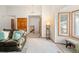 Bright living room featuring a staircase, large window and plush carpeting at 6008 S Van Gordon St, Littleton, CO 80127