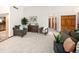 Spacious living room featuring plenty of seating and view to the entry hall at 6008 S Van Gordon St, Littleton, CO 80127