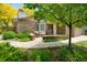 Home with stone and wood exterior featuring an outdoor patio with comfortable seating at 6008 S Van Gordon St, Littleton, CO 80127