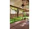Covered patio with skylights, ceiling fan, and view of landscaped backyard at 6008 S Van Gordon St, Littleton, CO 80127