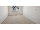 Empty bedroom with carpeted floor, window with blinds and white walls at 2855 Rock Creek Cir # 191, Superior, CO 80027