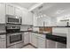 Updated kitchen featuring stainless steel appliances and white cabinets at 2855 Rock Creek Cir # 191, Superior, CO 80027