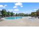 Community pool and hot tub surrounded by lounge seating and lush greenery at 2855 Rock Creek Cir # 191, Superior, CO 80027