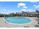 A community swimming pool with clear blue water, surrounded by lounge chairs and manicured grounds at 2855 Rock Creek Cir # 191, Superior, CO 80027