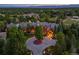 Aerial view of a luxury home, boasting lush landscaping, and a circular driveway at 4030 E Forbes Ct, Greenwood Village, CO 80121